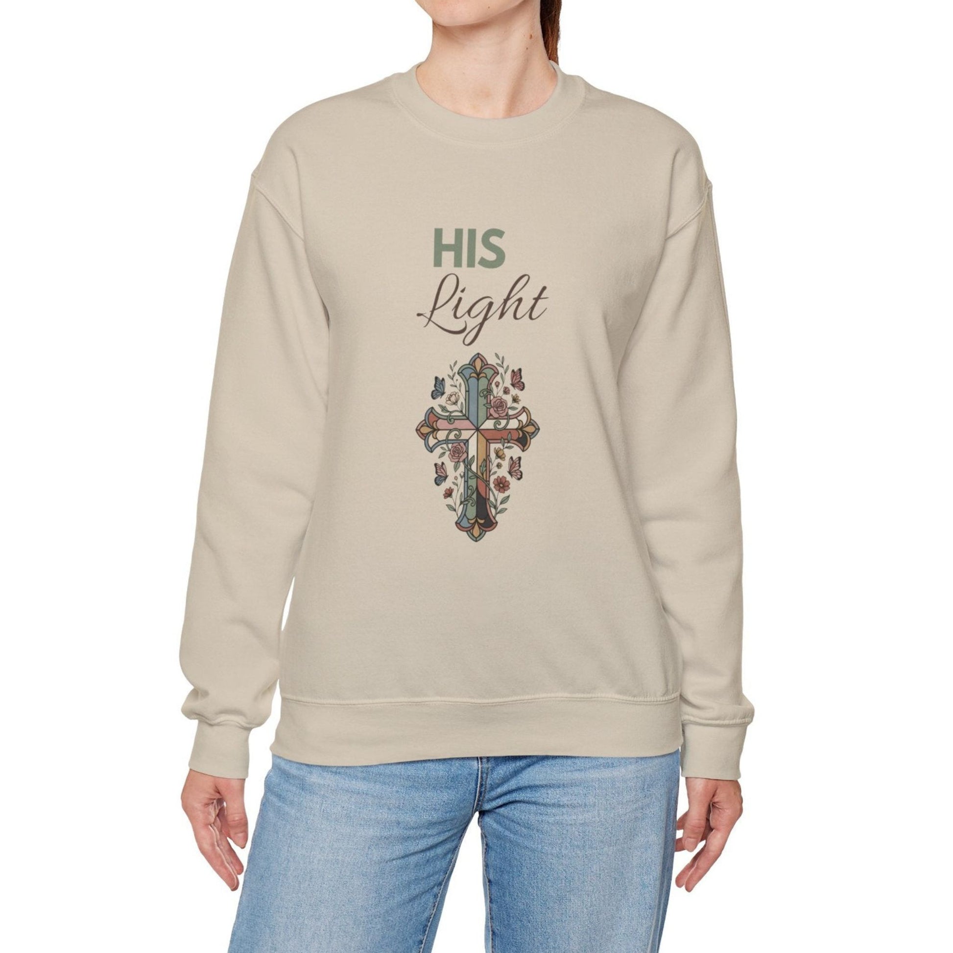 A woman is wearing a sand-colored sweatshirt with 'Hi Light' on the front.