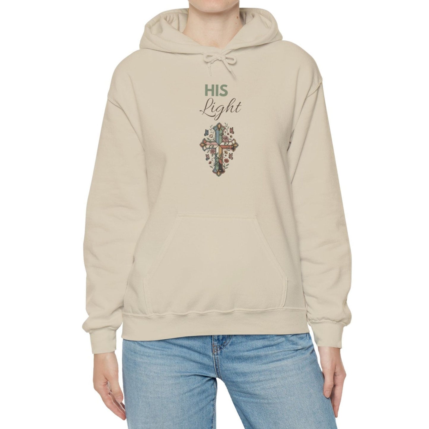 A woman is wearing a sand-colored hooded sweatshirt.