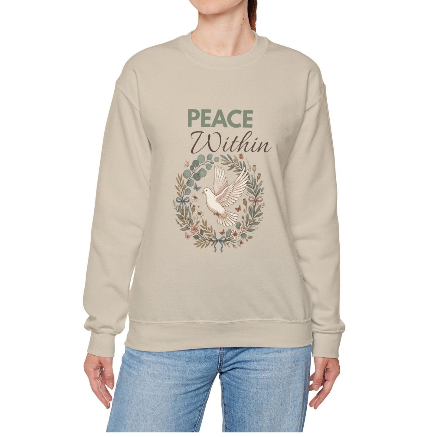 A woman is wearing a sand-colored sweatshirt with 'PEACE Within' on the front.