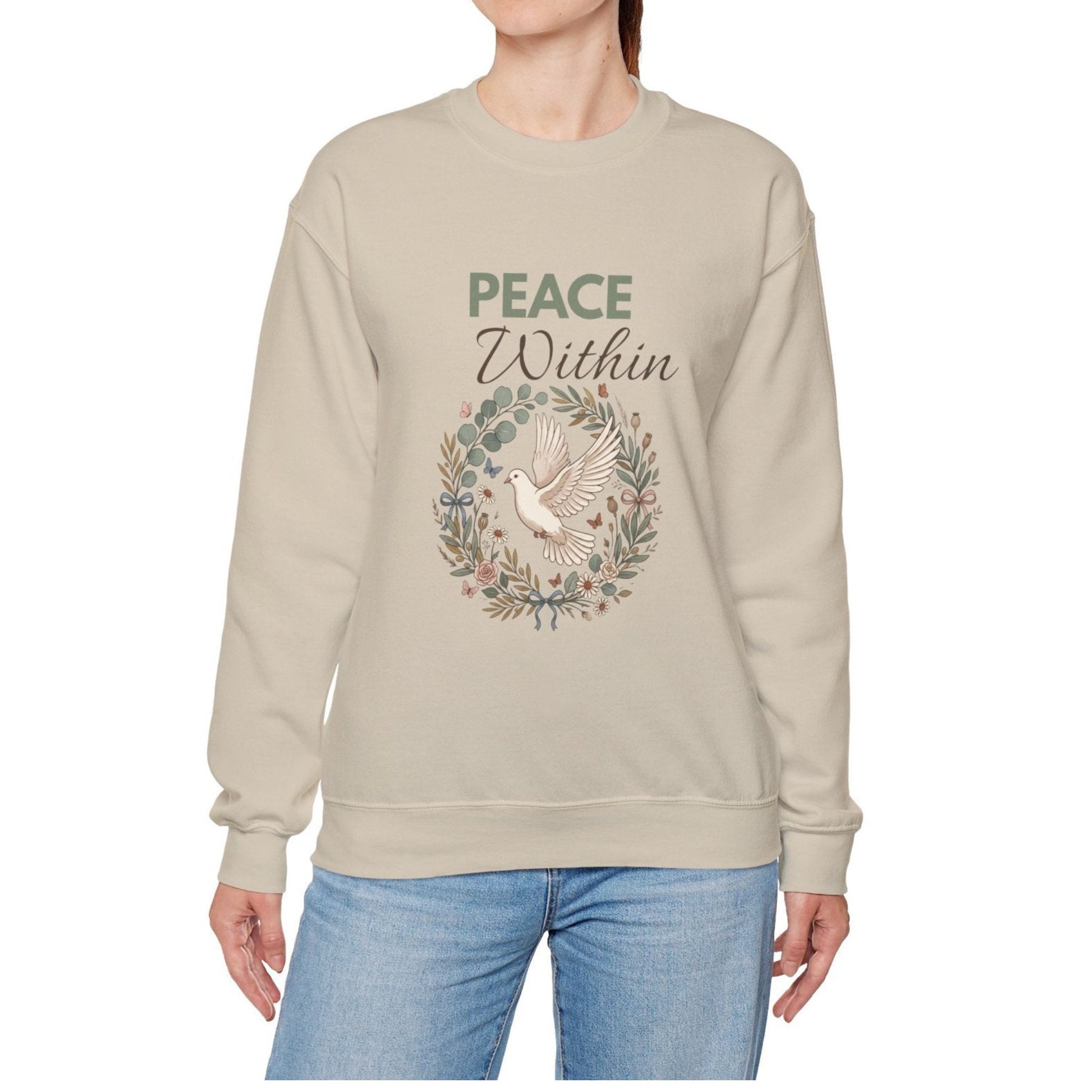 A woman is wearing a sand-colored sweatshirt with 'PEACE Within' on the front.