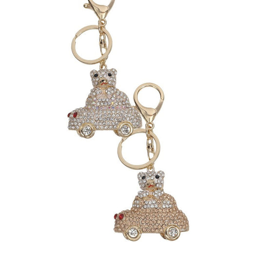 Keychain with teddy bear in car design on a white background