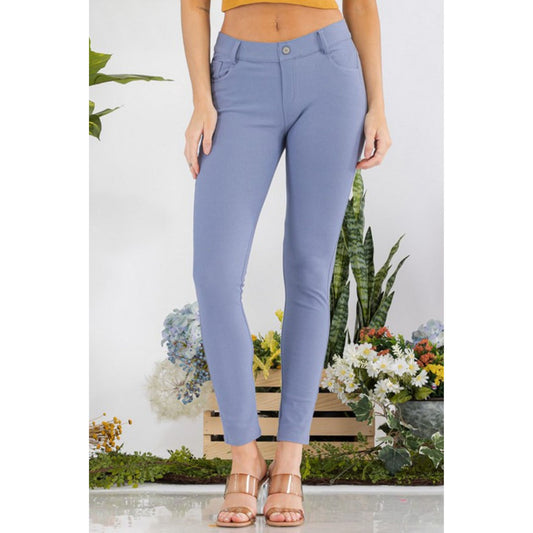 Light blue pants worn by a person with a floral and plant background