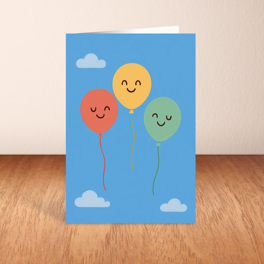 Greeting card with colorful balloons on a blue background