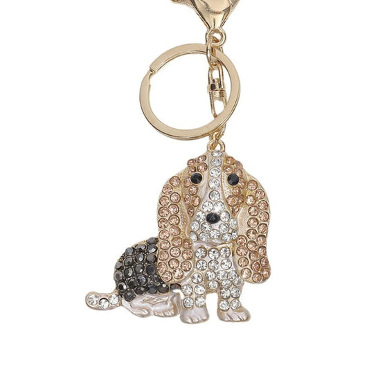 Dog-shaped keychain with rhinestones on a white background