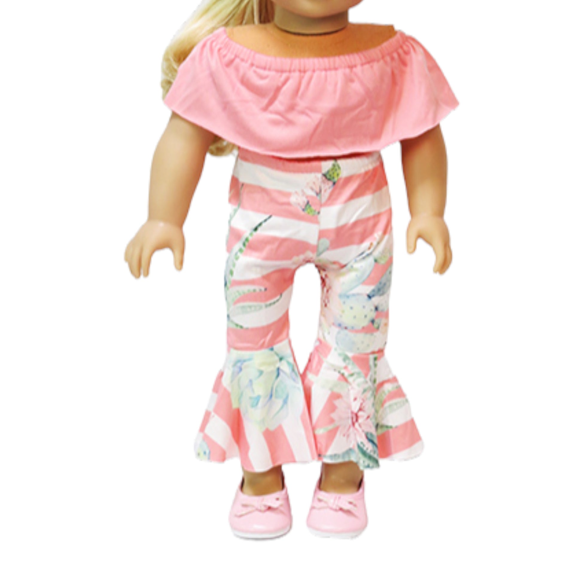 Doll wearing a pink top and colorful striped pants on a white background