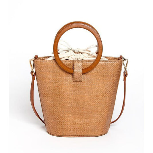 Woven handbag with wooden ring handles on a white background