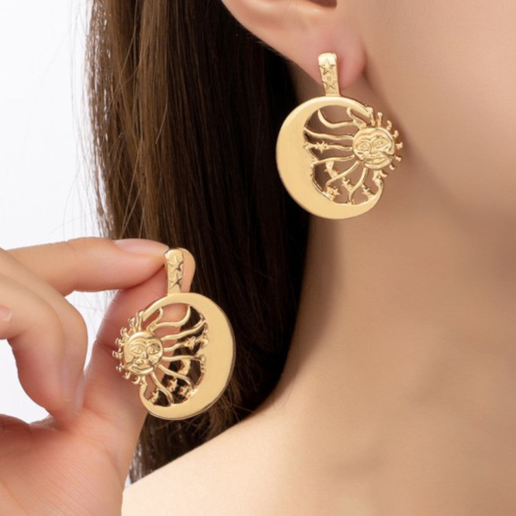 Sun Inside a Crescent Hoop Drop Earrings on Ear