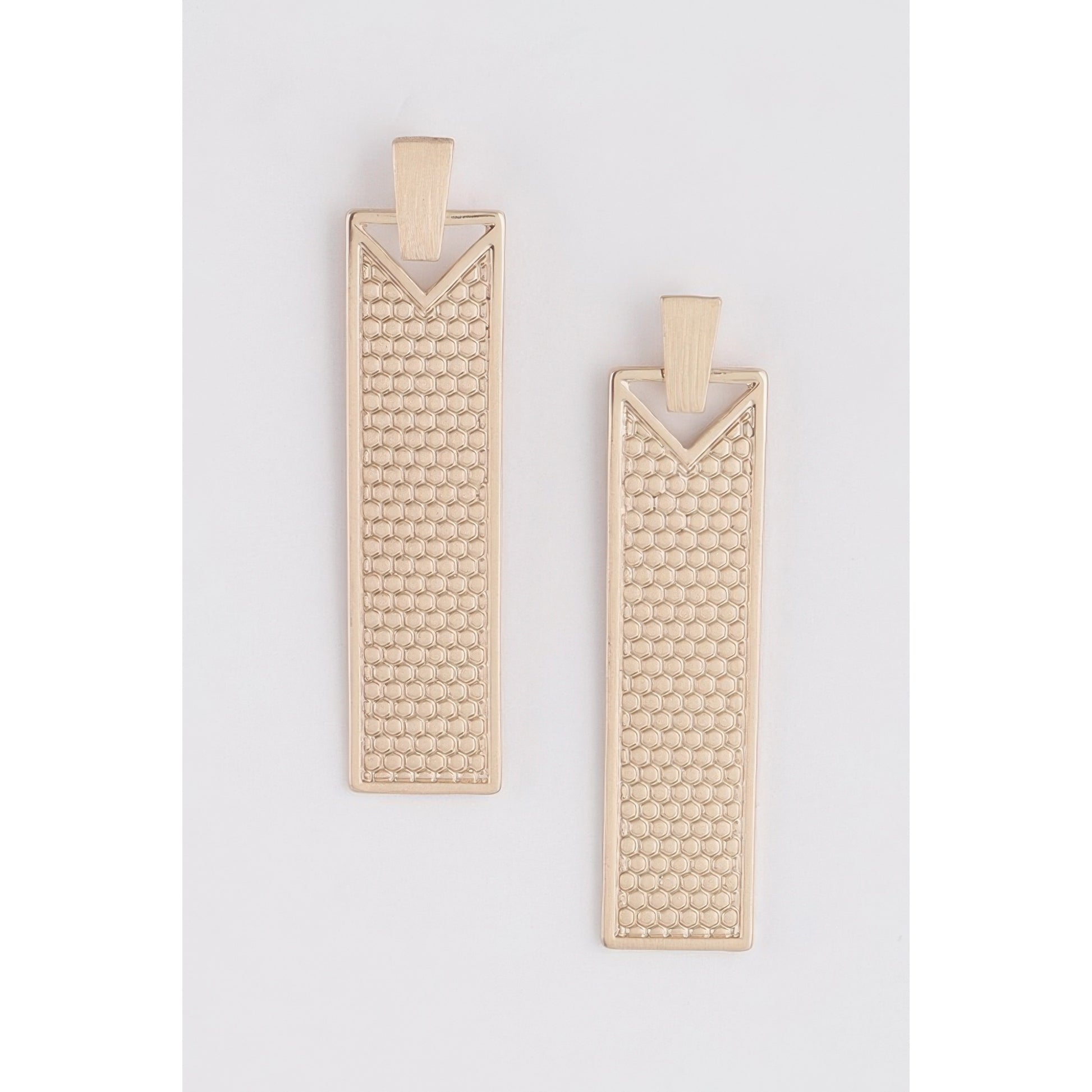 Two rectangular gold metal earrings with a textured honeycomb pattern and a V-shaped cutout at the top, displayed on a light gray background.