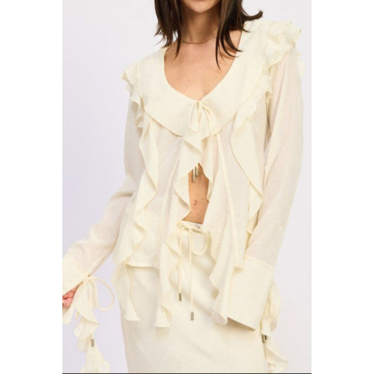 Woman wearing a light yellow ruffled outfit on a white background