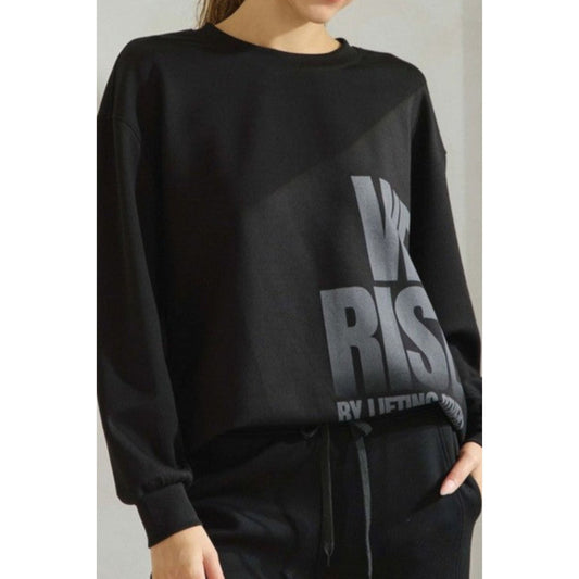 Black sweatshirt with text worn by a person on a plain background