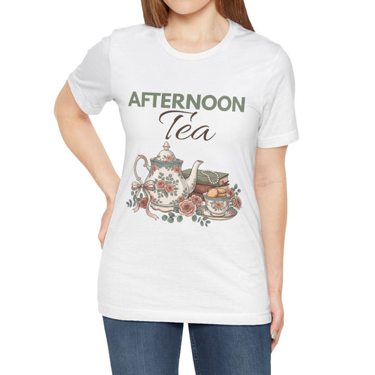 A woman is wearing a white t-shirt  with 'AFTERNOON Tea' on the front.