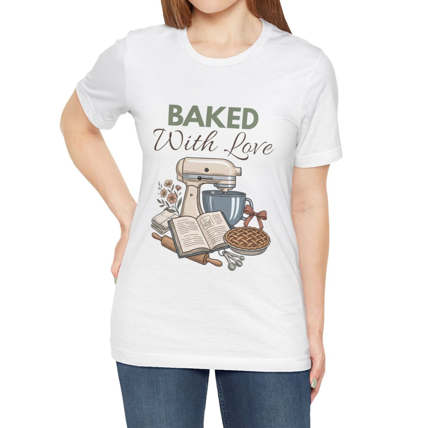 A woman wearing a white t-shirt with 'BAKED With Love' on the front.