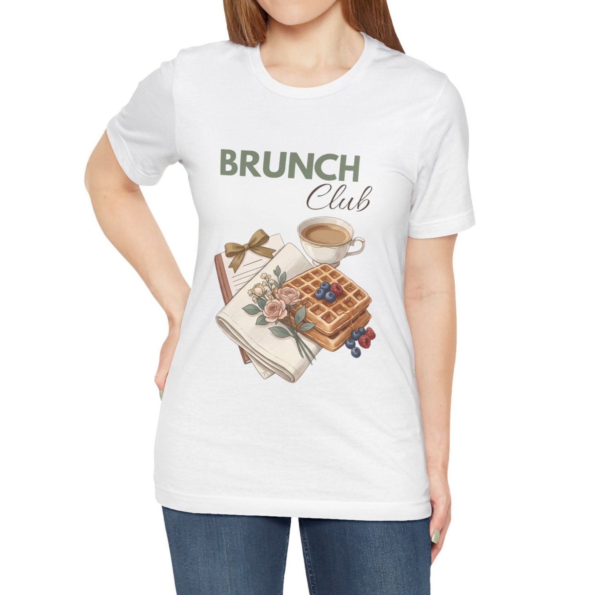 A woman is wearing a white t-shirt with 'BRUNCH Club' on the front.