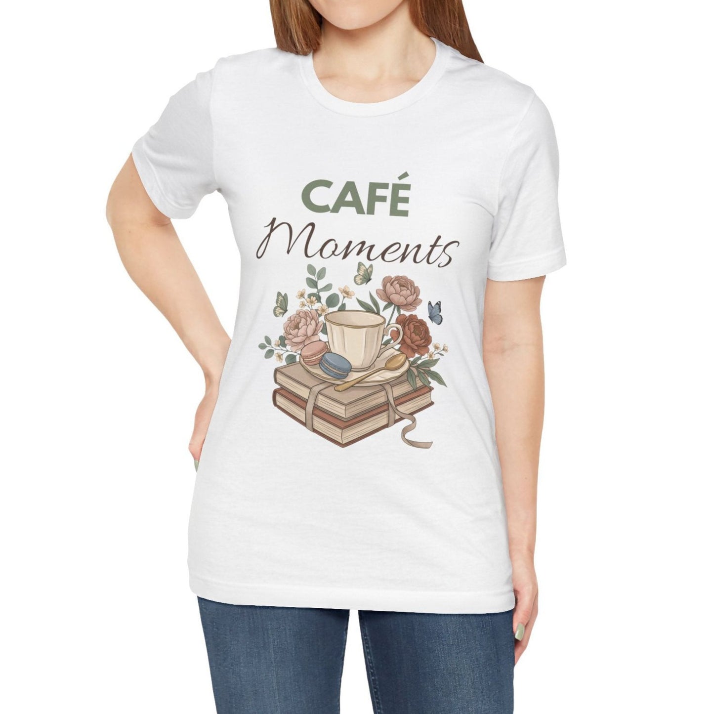White t-shirt with 'Café Moments' design featuring a coffee cup and books on a white background