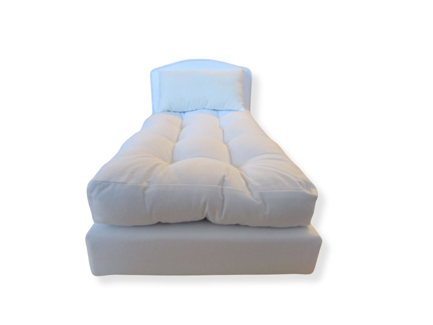 White doll bed on a white background