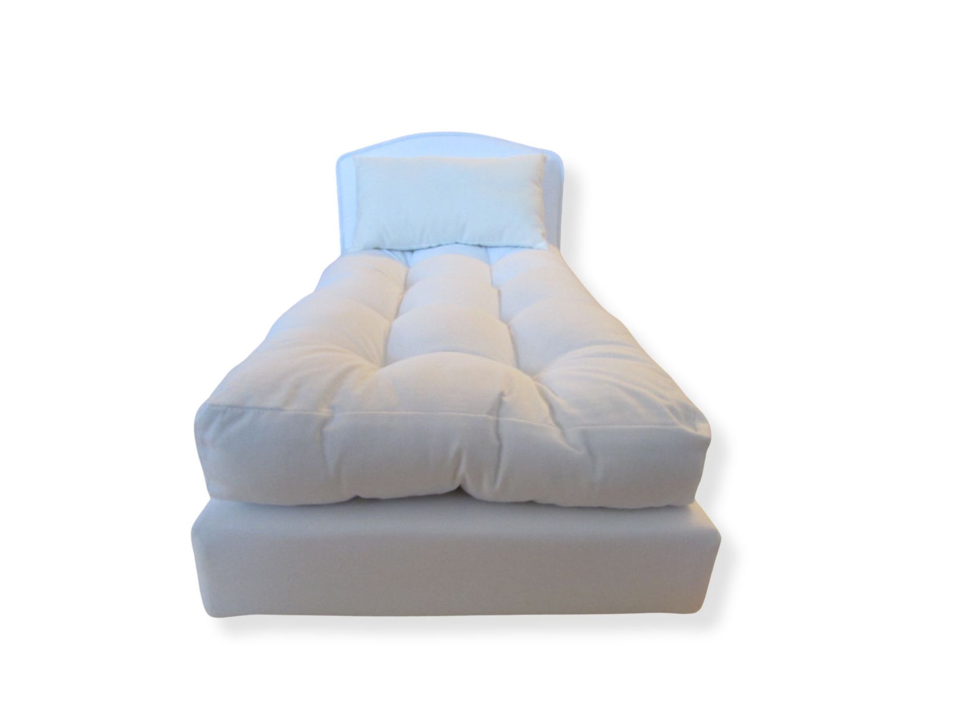White doll bed on a white background
