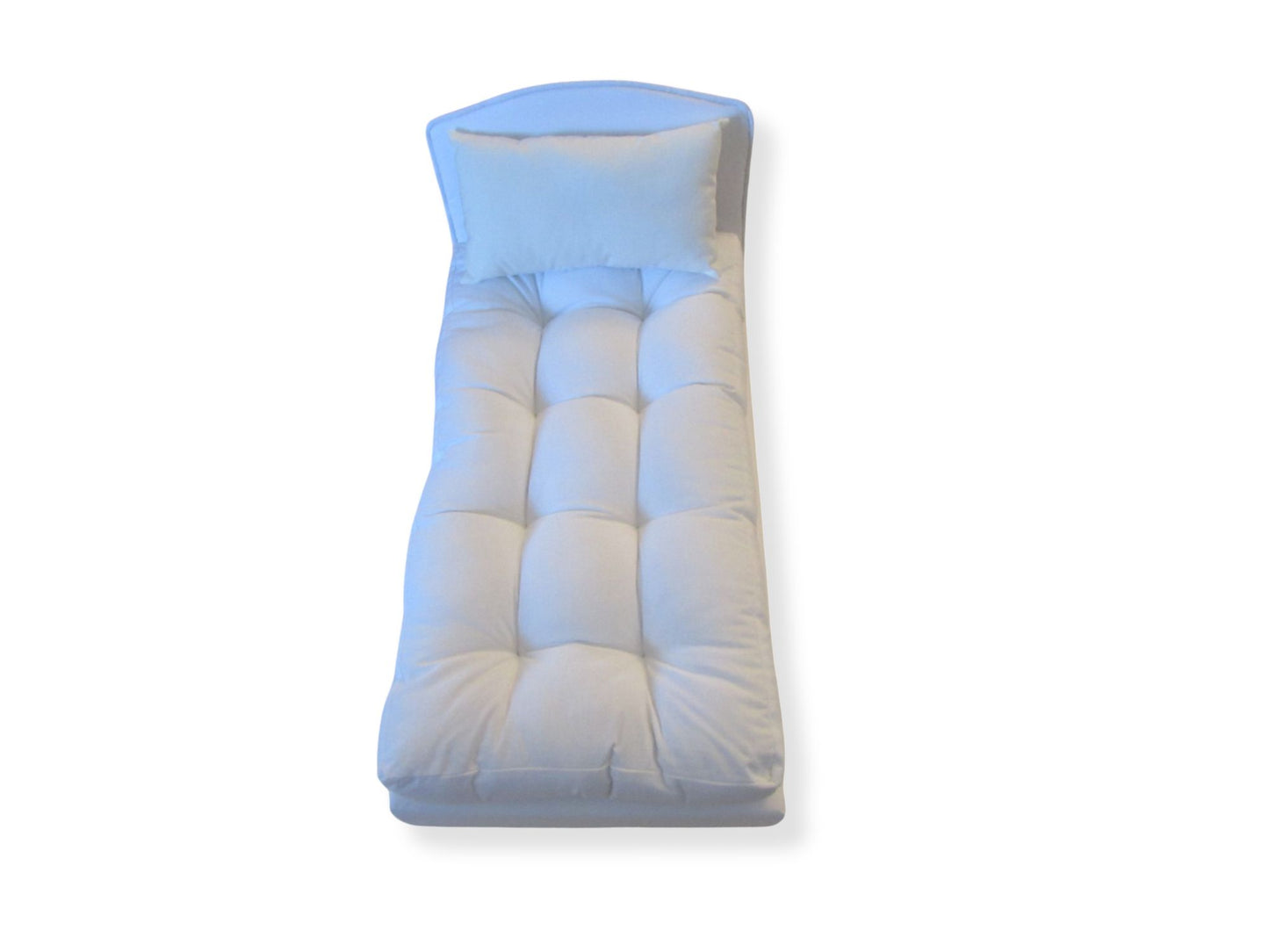 White doll bed on a white background