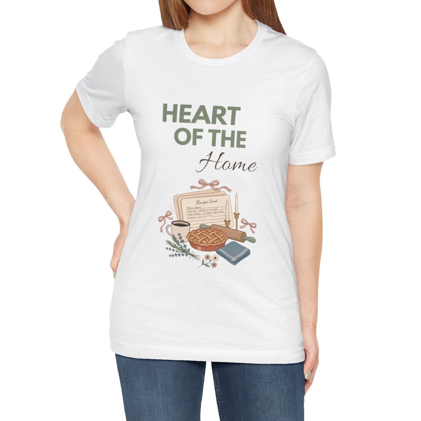 A woman wearing a t-shirt with 'HEART OF THE Home' on the front.