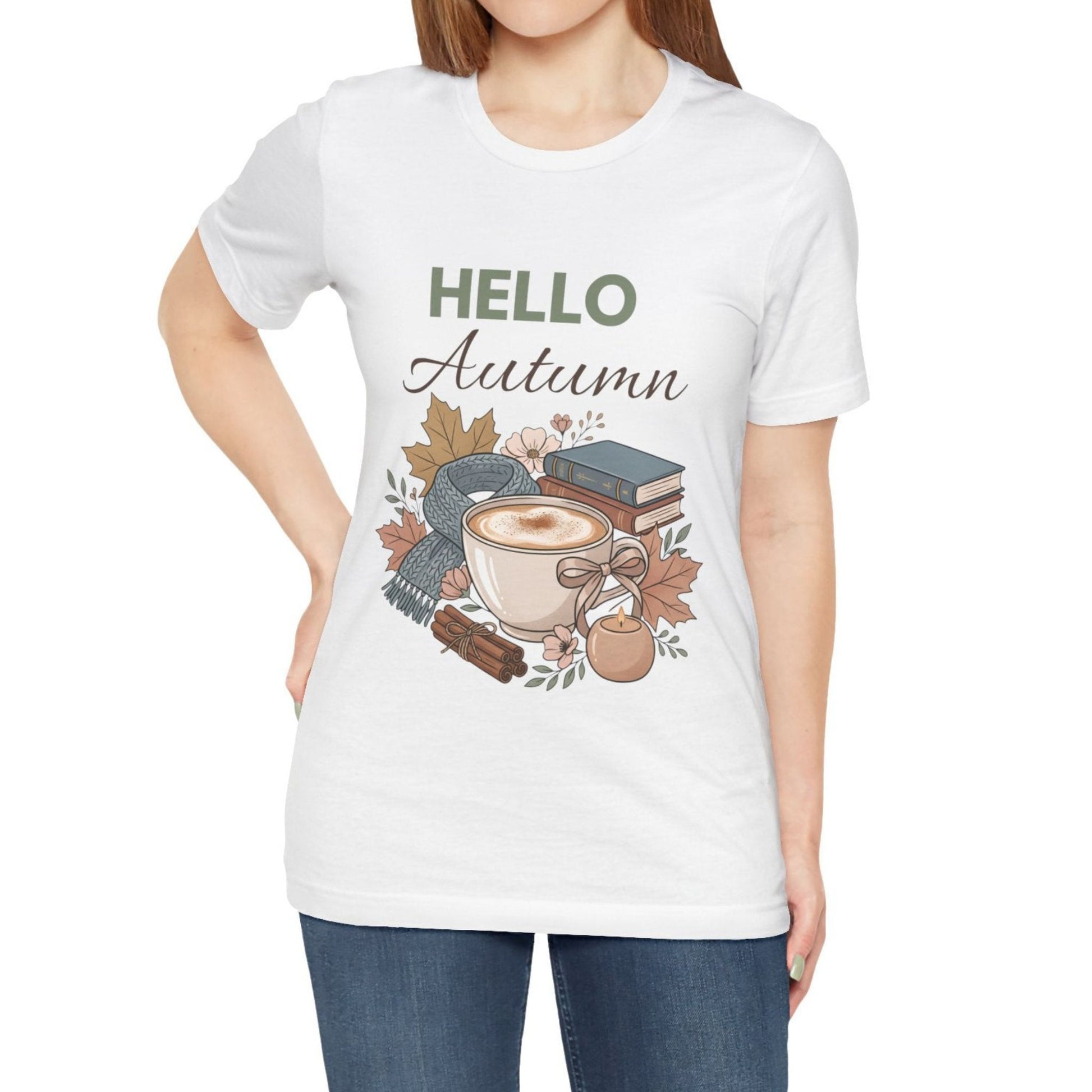 White t-shirt with 'Hello Autumn' design featuring a cup of coffee, books, and leaves.