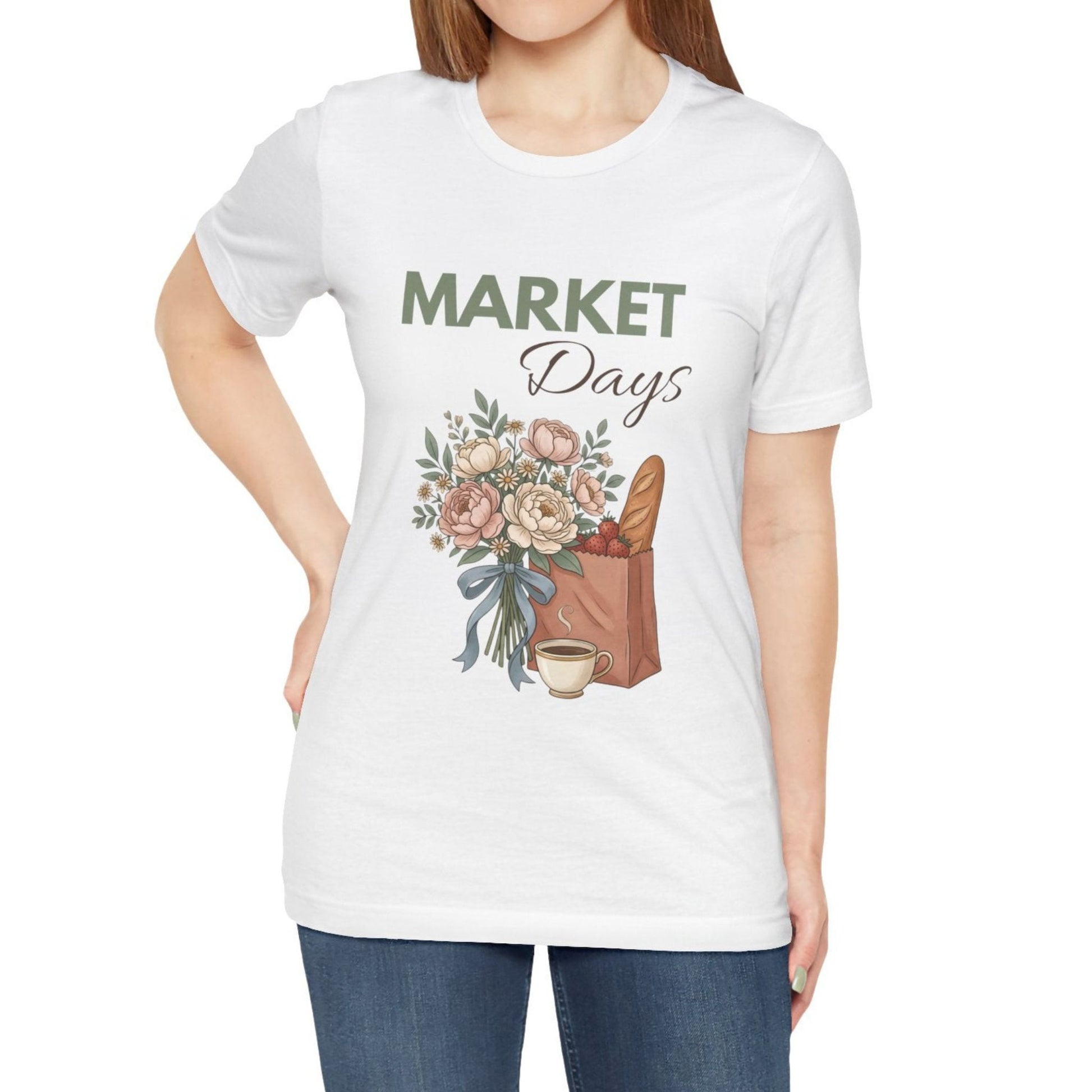 A woman wearing a white t-shirt with 'MARKET Days' on the front.