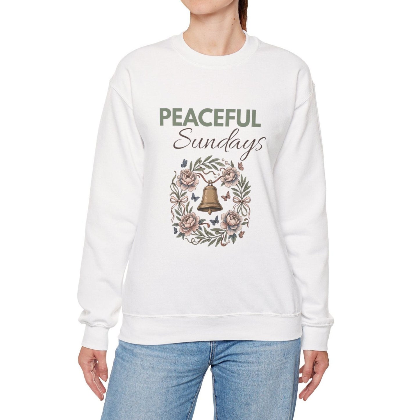 A woman is wearing a white sweatshirt with 'PEACEFUL Sundays' on the front.
