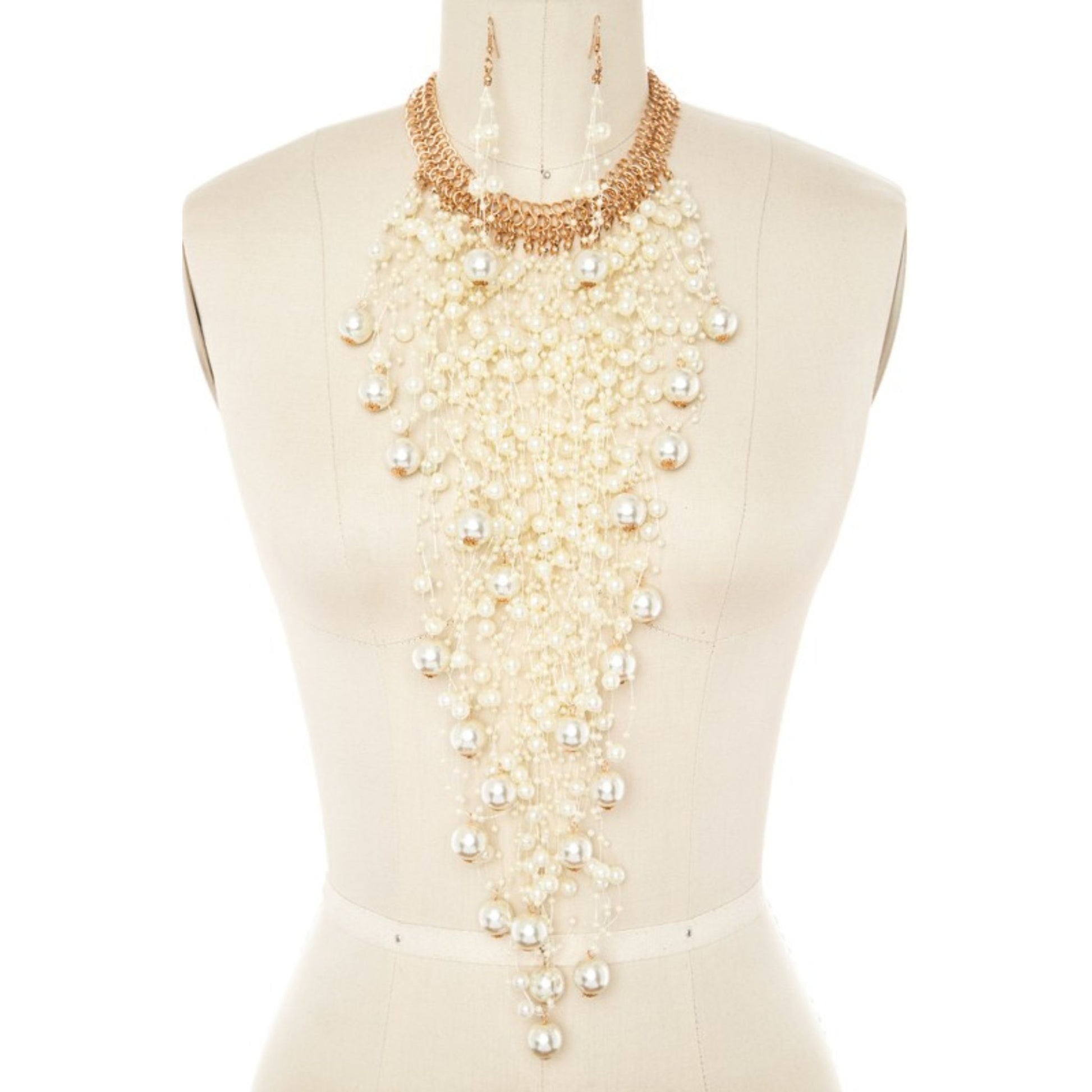 Mannequin wearing a long pearl necklace on a white background