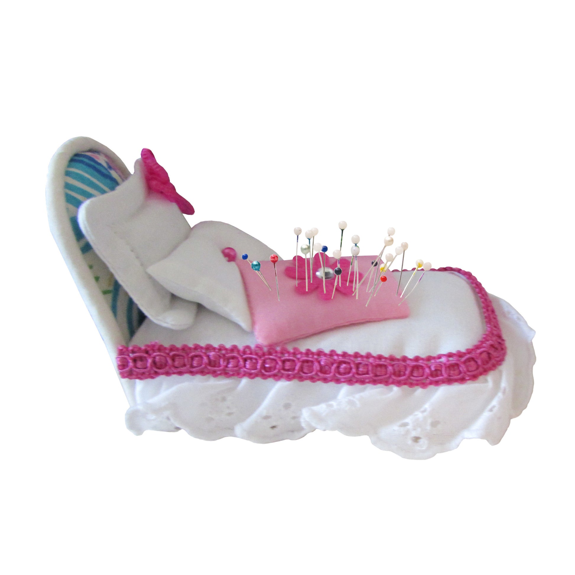 White Pincushion Bed with Pink-Trimmed Bedding Side view with pins